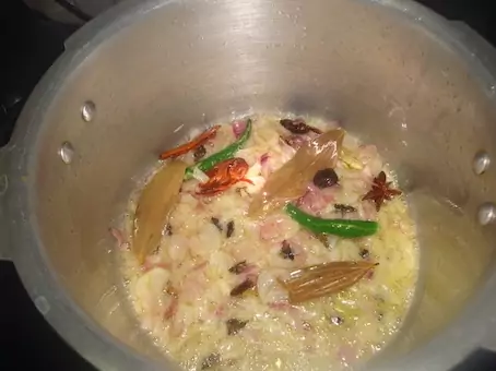 adding pastes into veg biryani recipe