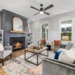 modern living room interior with light gray furniture and a fireplace