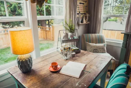 Table near a large window overlooking the garden