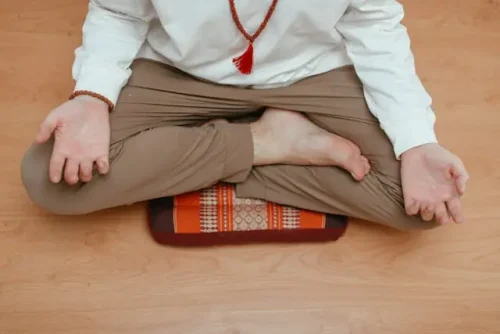 Man meditating on a cushion