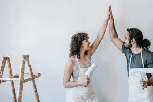 couple throwing high-five