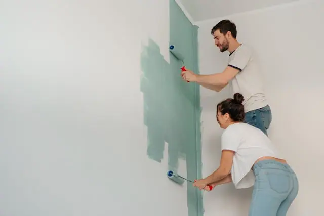 couple painting and choosing the right color for every room